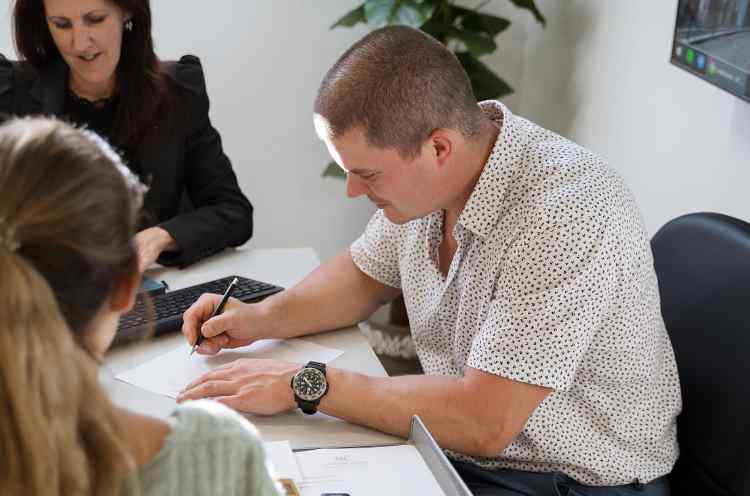 Signing documents to register a company in Zona Franca da Madeira Business registration signing process in Madeira Free Trade Zone